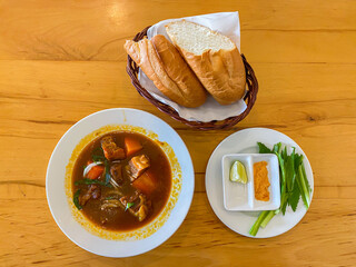Vietnamese cuisine - Bo Kho stewed beef served with bread 