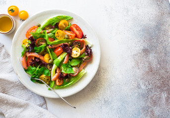 Mixed salad leaves, cherry tomatoes and salted salmon salad