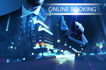 Businessman using virtual screen for online booking at night
