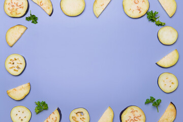 Frame made of fresh sliced eggplant on color background