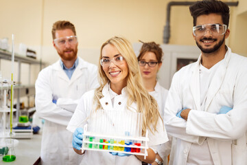 Group of medical scientists working at laboratory. Science, chemistry, medicine and people concept