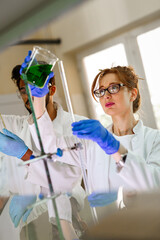Attractive young woman scientist working in laboratory