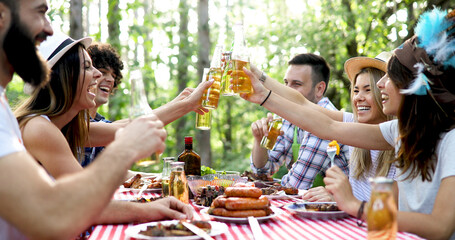Friends having a barbecue party in nature