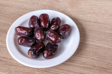 dried dates on a plate on the table