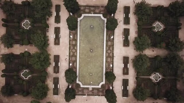 Spain Madrid Capilla Real fly up camera down Jardines de Sabatini gardens aerial drone shot look view from above autumn 