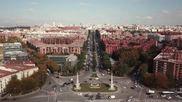 Spain Madrid Glorieta de Pyramids Celle de Toledo street drone shot aerial look view from above sunny day autumn flying towards and up