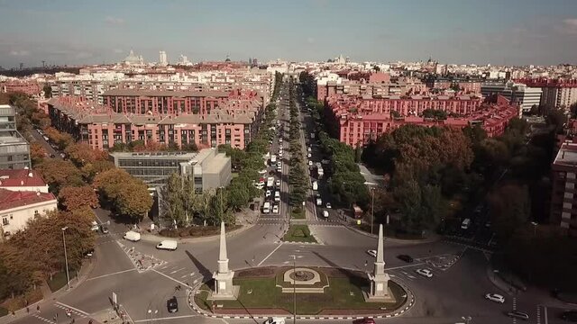 Spain Madrid Glorieta de Pyramids Celle de Toledo street drone shot aerial look view from above sunny day autumn flying towards