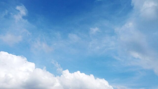 Timelapse Blue sky white white clouds. Puffy fluffy white clouds. Cumulus cloud scape timelapse. Summer blue sky time lapse. Dramatic majestic amazing blue sky. Soft white clouds form. 