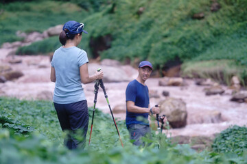 Asian middle-aged couple Are hiking on vacation