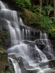 Obraz premium Close-up side view of rocky waterfall.