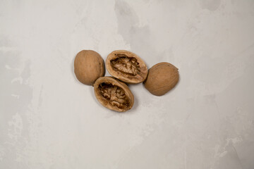 Chopped nuts on a neutral gray background, nutshells