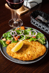 schnitzel with fresh sald and lemon