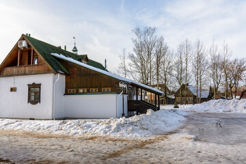Rural landscape with wooden houses in winter