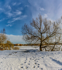 Rural landscape with wooden houses in winter