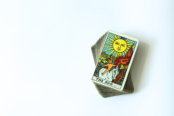 Tarot cards are placed on an oval deck of cards. With a white space on the left to write a message.