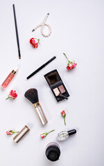 Cosmetics and fashion blogger background. Flat lay. Makeup, accessories on a light background. Top view shot.