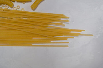long spaghetti noodles on gray background, food, cooking, ingredient