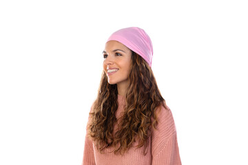 Hopeful woman with cancer wearing a thoughtful pink scarf