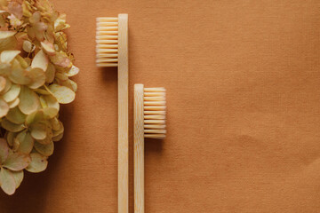 bamboo toothbrushes on a brown background. Concept photo