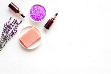 Fototapeta na wymiar Lavender cosmetics spa set. Natural spa essential oil and sea salt