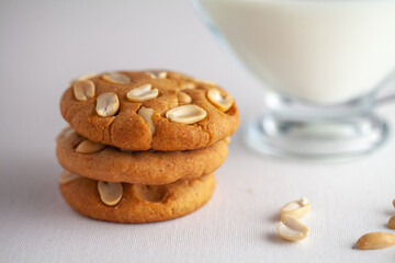 Homemade Baked Peanut cookies and milk in white background  