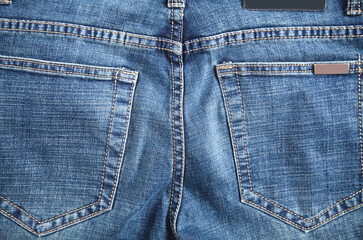 Fototapeta premium Blue jeans back pocket. Closeup