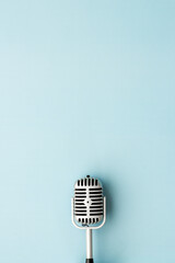 Retro style microphone. Aydio recording background. Top view - obrazy, fototapety, plakaty