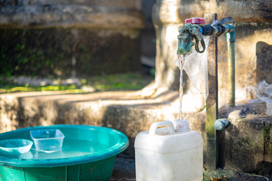 Dirty Water Coming Out Of Faucet For Poor Cummunity To Drink