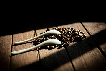 Spoon coffee and coffee beans prepared for the coffee brewing process.