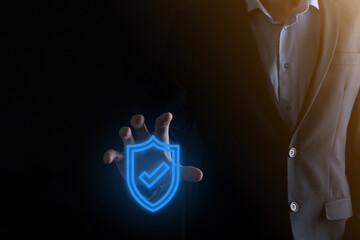 Protection network security computer in the hands of a businessman. business, technology, cyber security and internet concept - businessman pressing shield button on virtual screens Data protection