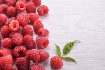 Summer berries food closeup.Fresh raspberries on a wooden background. Top view