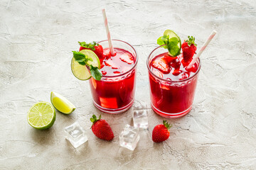 Strawberry cocktail or lemonade with ice and mint. Cold red drink