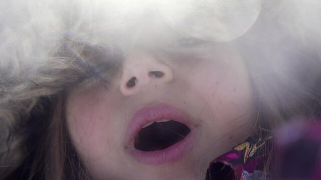 girl playing with snow in the mountains fim in slow motion