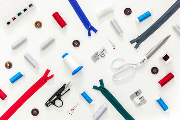 Sewing accessories and sewing supplies. Spools of thread, scissors and centimeter