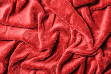 Soft fabric background. Red blanket texture. Wave material pattern. Decorative curtain textile background. Wool texture. Cotton fabric pattern.