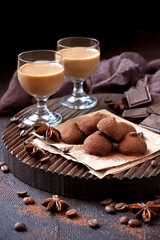  Sweet chocolate candy with liqueur in glass, dessert table