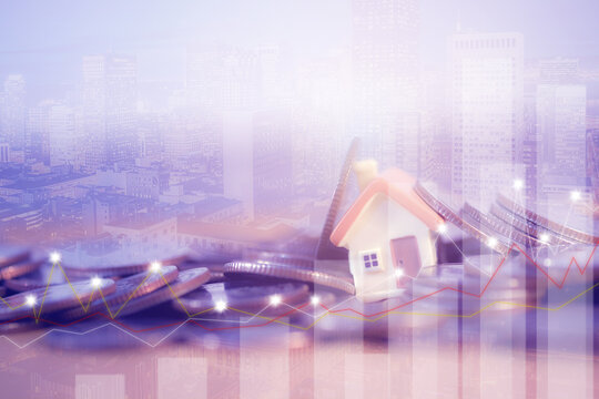 Financial investment concept, Double exposure of city night and stack of coins for finance investor, houses standing on stacks of coins.