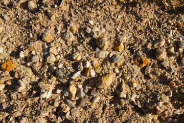 Extreme macro close up of fine beach sand surface pattern in the summer. Sandy trails, texture and background. Top view. Abstract Background. 