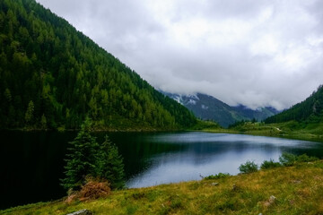 Naklejka na ściany i meble wonderful mountain lake with mountains and trees