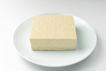 Tofu made with beans on white background