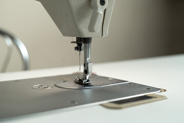 Sewing machine metal parts and accessories. Atelier for tailoring.