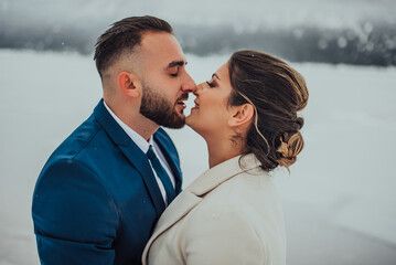 Beautiful wedding couple on their winter wedding