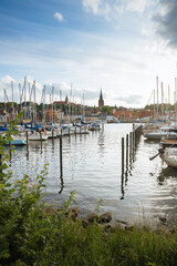 Fototapeta na wymiar Port for small ships in a city in Germany. Boating in the city