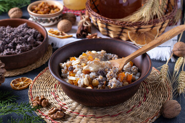 Fototapeta na wymiar Kutya is a ceremonial grain dish with poppy seeds, dried fruits, nuts and sweet gravy, traditionally served by Orthodox Christians in Ukraine, Belarus and Russia during Christmas.