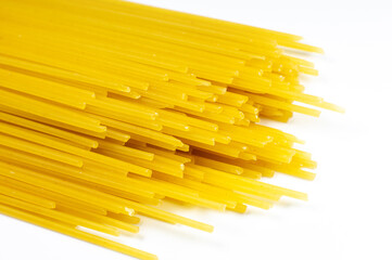 Close up uncooked pasta spaghetti macaroni on white background