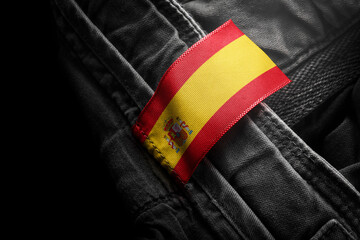 Tag on dark clothing in the form of the flag of the Spain