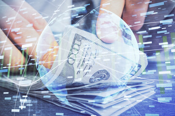 Multi exposure of financial theme drawing hologram and USA dollars bills and man hands. Business concept.
