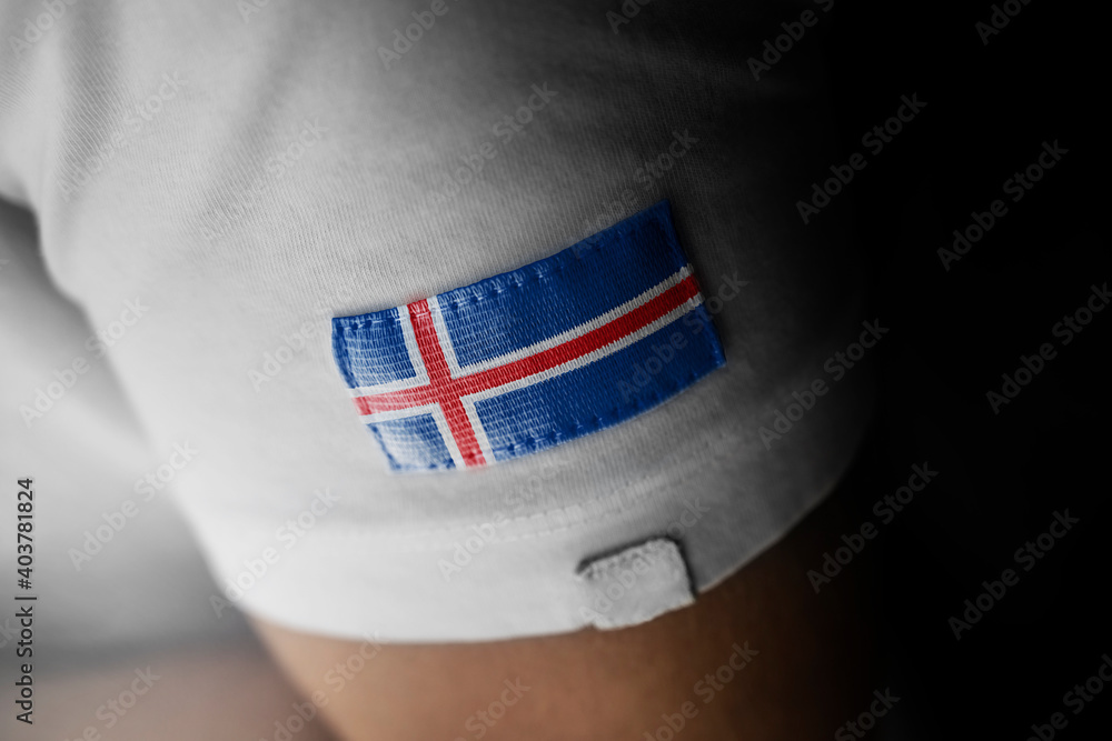 Wall mural patch of the national flag of the iceland on a white t-shirt