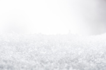 Snow or snowy surface close up, winter background with snowflakes
