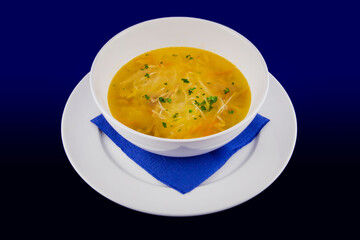 Hot chicken noodle soup with carrots and herbs